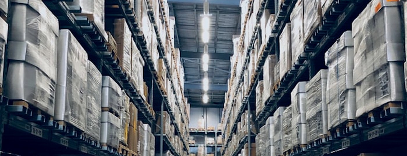 Warehouse aisle with stocked pallet racking